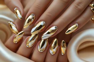 A set of nails painted in shimmering metallic gold and copper tones.