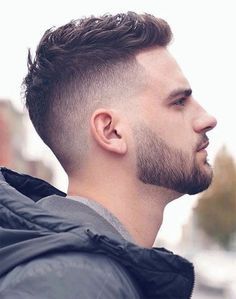 A man with a side part hairstyle, where the hair is neatly parted to one side, providing a classic and versatile look suitable for both casual and formal settings.